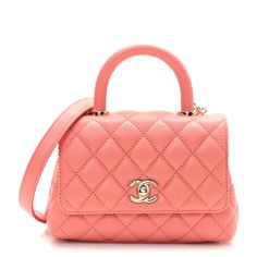 This is an authentic CHANEL Caviar Quilted Extra Mini Coco Handle Flap in Coral. This sleek classic tote is crafted of diamond quilted caviar leather in soft orange. The shoulder bag features an embossedtop handle, a rear patch pocket, a leather threaded light gold shoulder strap with a shoulder pad anda light goldCC turn-lock detail. This opens the half flap to a partitioned pink leather interior with a zipper pocket. Chanel Crossbody, Coco Handle, Chanel 19, Chanel Tweed, Soft Orange, Chanel Shoulder Bag, Leather Thread, Chanel Caviar, Pink Leather