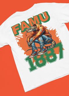 Dive into the spirit of Florida A&M University with our exclusive FAMU Rattlesnake 1877 Vintage T-Shirt. Designed for students, alumni, and fans, this shirt pays homage to the rich history and legacy of one of the most esteemed Historically Black Colleges and Universities in the United States. Crafted from premium cotton, this tee offers both comfort and durability, making it perfect for game days, casual wear, or alumni events. Featuring a striking graphic of the iconic FAMU mascot - the rattle Alumni Events, Homecoming Games, Vintage Tshirts, Graphic Tee, Screen Printing, Vintage Inspired, Gender Neutral, Graphic Tees, Florida