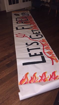 a long white banner with the words fire safety on it and flames coming out of it