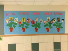 a bulletin board with plants and pictures on it that says good books draw great minds