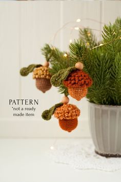 a potted plant with pine cones hanging from it's branches and the words pattern not a ready made item