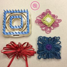 four pieces of crochet are arranged on a white surface with red, blue, and green ribbons