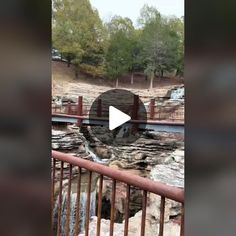 an image of a waterfall in the middle of a park with a video screen showing it