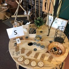 a wooden table topped with lots of different types of items on top of each other