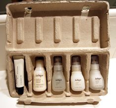 an egg carton filled with different types of skin care products