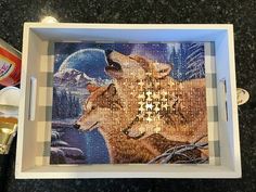 a puzzle with two wolfs on it