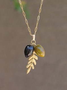 "These handmade olives are amazingly realistic! They just look like the real ones in size and colors. The beads are carefully crafted from Italian glass. They are about 15 mm/.56\". Single charm only can be purchased. Bail is 7.3 x 2.4 mm Chain is 14k gold filled and can be customized to different length. Olive branch is custom made from brass. This necklace is cute and fun to wear. It will make a wonderful and unforgettable gift. Be sure to view all of my fabulous item and I will be happy to co Olive Necklace, Silver Ball Necklace, Branch Necklace, White Pearl Earring, Ball Necklace, Olive Fruit, Green Olive, Choker Style, Olive Branch