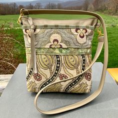 Crossbody or Shoulder Bag, medium-large Purse or Handbag made from beautiful quality Italian Leather and Gorgeous Chenille Upholstery Tapestry made in Turkey. Get rid of that boring Black Bag and carry something people will 💗! This is a Bag made to be used Everyday.   Deep open pocket and large zip pocket on outside of bag. 10" top zip opens to the roomy interior with 2 smaller pockets-one of them sized just right for the largest phone. Plus my signature clip-off key ring. 10 1/2" wide 10 1/2"d Luxury Crossbody Shoulder Bag With Zipper Pouch, Cream Shoulder Bag With Zipper Pouch For Travel, Luxury Beige Bag With Zipper Pouch, Luxury Beige Bags With Zipper Pouch, Beige Rectangular Hobo Bag With Handle Drop, Rectangular Beige Hobo Bag With Handle Drop, Beige Shoulder Bag With Zipper Pouch, Cream Rectangular Bag With Zipper Pouch, Elegant Tapestry Bags For Everyday Use