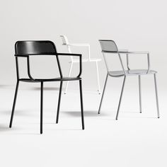 three chairs in different colors and sizes on a white background, one is black the other is white