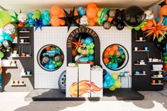 an assortment of balloons and decorations on display