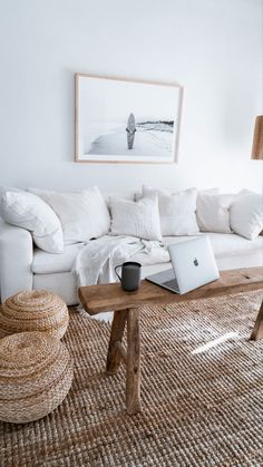 a living room with a white couch and coffee table