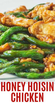 honey hoisin chicken and asparagus on a white plate with text overlay