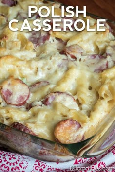 a casserole dish with potatoes and ham in it on a red and white cloth