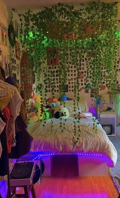 a bed room with a neatly made bed and plants on the wall