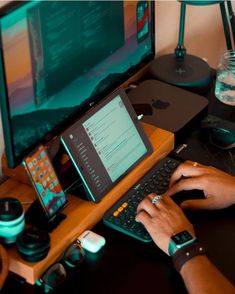 a man is typing on his computer keyboard