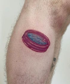 a close up of a person's arm with a tattoo design on the side