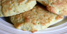 some biscuits are on a white plate and ready to be eaten