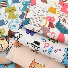 several different types of fabric with cats on them