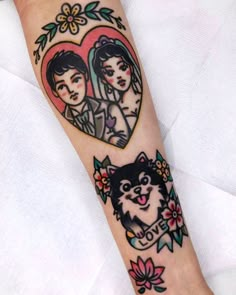 a woman with a cat tattoo on her arm next to a heart shaped frame and flowers