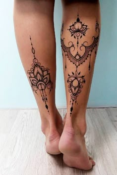 the legs are decorated with tattoos and designs