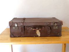 Antique Suitcase, Travel Luggage, Leather Train Case, Leather Valise, Suitcase Table An Antique (1920-30) travel suitcase,covered with genuine leather.. The suitcase is in Fair Antique condition (used) with a lot of spots upon metal and leather parts. The interion part is in Fair Antique Condition too. Only for Decorative purposes...its an antique suitcase... Please check all photos.. Leather Suitcase Dimensions: Base : 88 x 45 cm or 34.64 x 17.71 inches Height: 26.5 cm or 10.43 inches Weights a Brown Rectangular Travel Case, Brown Cases With Luggage Sleeve For Trip, Rectangular Brown Cases For Trip, Brown Rectangular Cases For Trip, Brown Rectangular Cases For Trips, Brown Rectangular Travel Bag, Antique Suitcase, Suitcase Table, Trunk Luggage