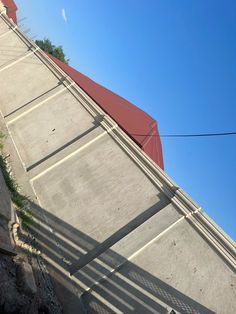 a skateboarder is doing a trick in the air on a ramp near a building