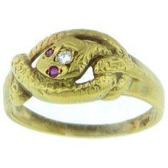 This Vintage Styled Snake Design 14 kt Yellow Gold ring Features a beautiful Carved Snake Design featuring 2 Rubies as the eyes and 1 Diamond on the head. It's definitely 1 of a kind and perfect for the animal lover or just someone who wants something meaningful and unique. Pictured ring weighs 4.5 g Dimensions: (WxH) Top: 10 mm x 4 mm Band 1.5 mm x .05mm Additional details: 1) We chose to list this item in 14kt yellow gold based on internal studies showing that, that combination was the most co Antique Ruby Ring With Diamond Accents, Antique Hallmarked Snake Ring, Antique Three Stone Gold Jewelry, Antique Gold Three-stone Jewelry, Hallmarked Yellow Gold Snake Ring For Anniversary, Heirloom Yellow Gold Snake Ring For Anniversary, Heirloom Yellow Gold Snake Ring, Ceremonial Yellow Gold Diamond Ring, Heirloom Style Snake Ring For Anniversary