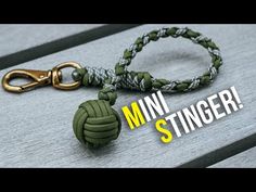 an image of a green and white lanyard with the words mini stringer