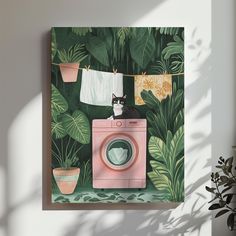 a cat is sitting on top of a washing machine in front of plants and towels