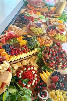 a table filled with lots of different types of fruits and veggies on it