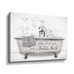 an old fashioned bathtub with soap bubbles on the wall and a towel hanging from it