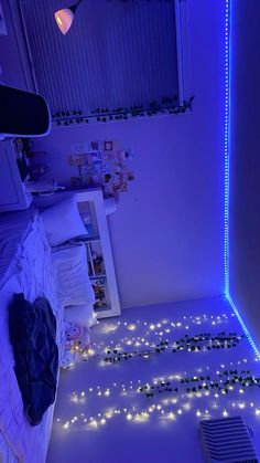 a bedroom with blue lights on the floor