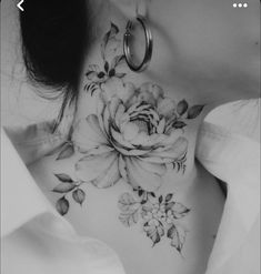 a woman's neck with flowers on it