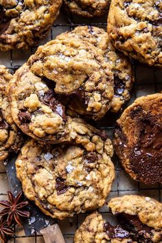 chocolate chip cookies on a cooling rack with anisette and star aniset