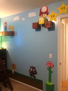 a room with mario bros decorations on the wall