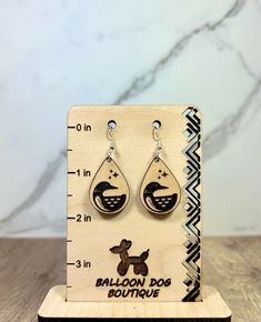 Large Loon Teardrop Engraved Wood Dangle Earrings Length of Total Earring with hook = 2 inch Measurements:  Length = 1.75 inch Width = 1.25 inch    Hypoallergenic Hooks with with Silicone Clear Push Ear Backing.  Shipment Time:  These are ready to ship and will ship within 1-2 Business Days. Please update address before placing an order. It is our priority that you receive your order as soon as possible.  Return Policy:  All sales are final. No refunds. Once items are in the possession of USPS, they are held responsible for any lost, damage, or destruction of packing. If item is defective upon arrival, please contact us immediately to discuss further options. Teardrop Fish Hook Earrings Gift, The Possession, Wood Dangle Earrings, Big Lake, Dog Boutique, Balloon Dog, Engraved Wood, Etsy Earrings Dangle, Jewelry Earrings Dangle