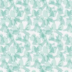 a blue and white background with green leaves on the left hand side, in shades of light teal