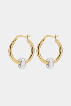 The classic gold hoop reinvented. Crafted in high polish 18K Gold vermeil with sterling silver accent, the Greyson hoops are a staple in the Hydez Essential Collection. These sophisticated head-turners will luxe up any look. Our two tone design means you’ll never have to choose between gold and silver.Materials: 18K Gold Vermeil and Sterling SilverDimensions: 20mm hoop, 3mm width What is 18K Gold Vermeil?: 3 microns of 18K Gold over Sterling Silver. Vermeil is far more durable to wear than tradi 14k White Gold Hallmarked Huggie Earrings, Silver 14k Gold Polished Huggie Earrings, 14k Gold Silver Huggie Earrings With Polished Finish, 14k White Gold Polished Huggie Earrings, Silver Polished Gold-plated Hoop Earrings, Silver 14k Gold Plated Hoop Earrings, Yellow Gold Plated Sterling Silver Hoop Earrings, Luxury Gold Sterling Silver Hoop Earrings, Sterling Silver Plated Hoop Earrings