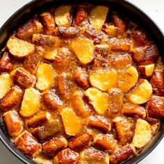 a pan filled with food sitting on top of a table