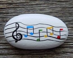 a rock with musical notes painted on it