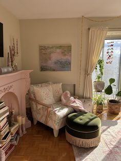 a living room filled with furniture and a fire place in front of a large window