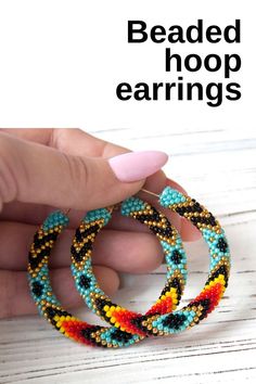 the beaded hoop earrings are made with multicolored seed beads