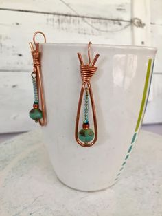 "Handcrafted copper and czech glass bead earring, approx 2.5\" long, but can be made shorter or longer. There are two finish variationsnon tarnish copper, or non tarnish silver over copper." Artisan Copper Beaded Drop Earrings, Adjustable Turquoise Beaded Copper Earrings, Unique Copper Beaded Dangle Earrings, Unique Copper Earrings With Dangling Beads, Unique Beaded Dangle Earrings, Unique Copper Beaded Earrings Nickel Free, Unique Nickel-free Copper Beaded Earrings, Handmade Turquoise Earrings With Copper Wire, Adjustable Copper Beaded Drop Earrings