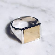 925 Sterling Silver and glossy Brass Mixed Metal Ring in sizes for both men and women. This minimalist ring has a simplistic brass square flat top but lot's of style and flat top rings are definitely in right now! Available in Gold Brasshttps://etsy.me/2w23uLWRing Size Available in all sizes. Please be sure to find your exact ring size for the finger you want before ordering. See image chart above or you can use the chart on my website as a guide - https://jewelrylab.co/pages/ring-sizing-tipsEve Flat Top Ring, Mens Pinky Ring, Gold Pinky Ring, Unique Mens Rings, Mens Band Rings, Mixed Metal Rings, Chic Flats, Rings Unique, Top Rings