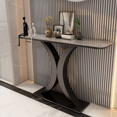 a modern console table in front of a wall with vertical striped walls and white marble flooring