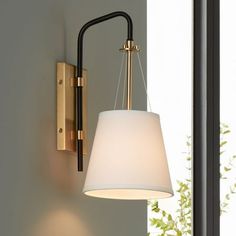 a lamp that is on the side of a wall