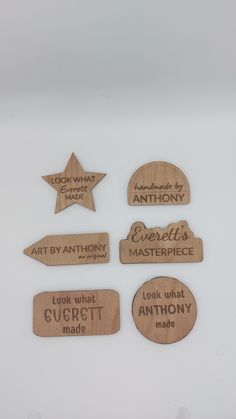 wooden name tags and magnets on a white surface