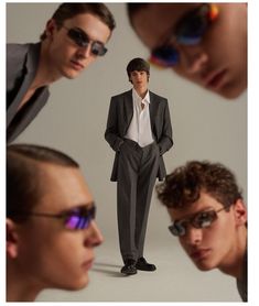 three men in suits and sunglasses looking at each other with one man's reflection