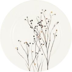 a white plate with some black and brown flowers on it