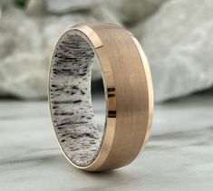 a wedding ring with an antler wood inlay